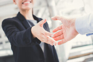 Professional handshake between man and woman