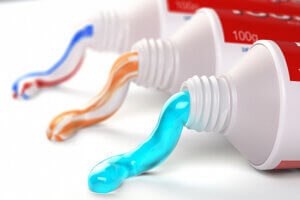 three tubes of toothpaste